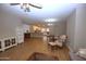 Spacious living area featuring wood-look tile flooring, modern furnishings, and open floor plan at 2150 W Alameda Rd # 1109, Phoenix, AZ 85085