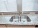 Close up of a double sink with granite countertops and modern fixtures at 2150 W Alameda Rd # 1109, Phoenix, AZ 85085