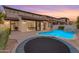Beautiful backyard with a sparkling pool, fountain, and covered patio perfect for outdoor gatherings at 22317 N 39Th Run, Phoenix, AZ 85050