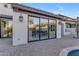 Backyard featuring a large sliding glass door leading to the dining room and pool at 22317 N 39Th Run, Phoenix, AZ 85050