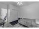Simple bedroom design with light gray walls, a ceiling fan, and a closet with sliding doors at 22317 N 39Th Run, Phoenix, AZ 85050