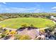 Aerial view of the beautiful community green with landscaped circular walkway and mature trees at 22317 N 39Th Run, Phoenix, AZ 85050
