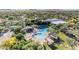 Aerial view of a large community pool with cabanas, lounge chairs, and well-maintained landscaping at 22317 N 39Th Run, Phoenix, AZ 85050