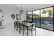 Bright dining room features large window views of backyard pool and water feature at 22317 N 39Th Run, Phoenix, AZ 85050