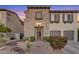 Charming two-story home with stone accents and desert landscaping in the front yard at 22317 N 39Th Run, Phoenix, AZ 85050