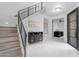 Bright foyer with staircase, modern console table, and stylish decor at 22317 N 39Th Run, Phoenix, AZ 85050