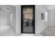 Bright interior view of the backyard through the glass paneled entry door at 22317 N 39Th Run, Phoenix, AZ 85050