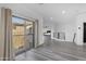 Hallway view featuring luxury vinyl flooring and balcony access overlooking the neighborhood at 22317 N 39Th Run, Phoenix, AZ 85050
