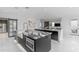 Expansive kitchen showcasing dual islands with unique countertops, stainless steel appliances, and ample natural light at 22317 N 39Th Run, Phoenix, AZ 85050