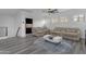 Bright and airy living room offers a ceiling fan and comfortable seating at 22317 N 39Th Run, Phoenix, AZ 85050