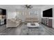 Bright and airy living room offers a ceiling fan and comfortable seating at 22317 N 39Th Run, Phoenix, AZ 85050