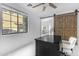 Bright office featuring a desk, a ceiling fan and a large window at 22317 N 39Th Run, Phoenix, AZ 85050
