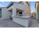 Outdoor kitchen featuring a stone bar with stainless steel grill and sink at 22317 N 39Th Run, Phoenix, AZ 85050