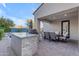 Inviting outdoor living space featuring a built-in grill, dining area, and easy access to the pool at 22317 N 39Th Run, Phoenix, AZ 85050