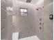 Walk-in shower features a window, bench, and dual shower heads at 22317 N 39Th Run, Phoenix, AZ 85050