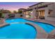 Backyard pool area featuring a sparkling pool, spa, covered patio, and a seamless indoor/outdoor living transition at 22317 N 39Th Run, Phoenix, AZ 85050