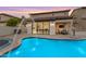 Beautiful backyard featuring a pool, spa, covered patio, and modern design at 22317 N 39Th Run, Phoenix, AZ 85050