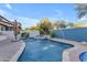 Beautiful backyard pool area with mature trees, privacy landscaping, and a built-in spa at 22317 N 39Th Run, Phoenix, AZ 85050