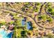 Aerial view showcases community tennis courts, pool, and scenic neighborhood layout at 22317 N 39Th Run, Phoenix, AZ 85050