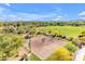 Aerial view of a well-maintained volleyball court, surrounded by lush greenery and walking paths at 22317 N 39Th Run, Phoenix, AZ 85050