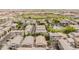 Aerial view of a housing community and a baseball field with well-maintained roofs and landscaping at 2402 E 5Th St # 1498, Tempe, AZ 85288