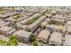 Aerial view of a well-maintained residential community with mature trees, landscaping and neatly arranged homes at 2402 E 5Th St # 1498, Tempe, AZ 85288