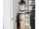 Organized walk-in closet with multiple shelves and storage solutions maximizes space and convenience at 2402 E 5Th St # 1498, Tempe, AZ 85288