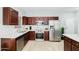 Modern kitchen with stainless steel appliances and dark wood cabinetry offers a stylish design at 2402 E 5Th St # 1498, Tempe, AZ 85288