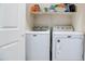 Functional laundry room with modern washer and dryer units for efficient home care at 2402 E 5Th St # 1498, Tempe, AZ 85288