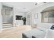 Bright living room with hardwood floors, recessed lighting, and access to outdoor patio area at 2402 E 5Th St # 1498, Tempe, AZ 85288