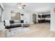 Open floor plan showcasing the living room, dining area, and kitchen with hardwood floors at 2402 E 5Th St # 1498, Tempe, AZ 85288