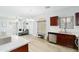 Open floor plan showcasing the living room, dining area, and kitchen with hardwood floors at 2402 E 5Th St # 1498, Tempe, AZ 85288