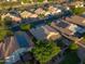 A high angle shows homes with desert landscaping and solar panels in a residential neighborhood at 2434 S Colleen Sw --, Mesa, AZ 85210