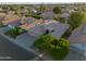 Aerial view of home with solar panels, mature trees and well-kept landscaping at 2434 S Colleen Sw --, Mesa, AZ 85210
