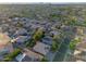 Expansive aerial view of neighborhood homes with desert landscaping and solar panels on many roofs at 2434 S Colleen Sw --, Mesa, AZ 85210