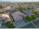 Aerial view of a desert home with solar panels, manicured landscaping and pool at 2434 S Colleen Sw --, Mesa, AZ 85210