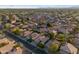 Panoramic aerial shot features a well-planned neighborhood, adorned with desert landscaping and multiple solar panels at 2434 S Colleen Sw --, Mesa, AZ 85210