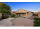 Expansive backyard with lush landscaping and a beautiful covered patio at 2434 S Colleen Sw --, Mesa, AZ 85210