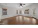 Large bedroom featuring a ceiling fan, hard wood floors and many large windows at 2434 S Colleen Sw --, Mesa, AZ 85210