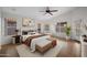 Stylishly furnished bedroom offers ample lighting, accent rug, and a comfortable seating area at 2434 S Colleen Sw --, Mesa, AZ 85210