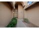 Welcoming front entrance adorned with lush greenery, offering a charming approach to the home at 2434 S Colleen Sw --, Mesa, AZ 85210