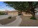 Charming home with a well-manicured front yard, three-car garage and lovely walkway leading to the front door at 2434 S Colleen Sw --, Mesa, AZ 85210