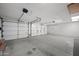 Spacious three car garage with finished concrete floor at 2434 S Colleen Sw --, Mesa, AZ 85210