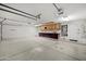 Spacious garage with finished concrete floor and built-in storage cabinets at 2434 S Colleen Sw --, Mesa, AZ 85210