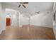 Bright and spacious living room with tile floors, high ceilings, and ample natural light from large windows at 2434 S Colleen Sw --, Mesa, AZ 85210