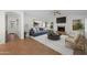 A stylish living room is designed with modern furniture and an inviting fireplace at 2434 S Colleen Sw --, Mesa, AZ 85210