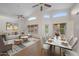 Stylishly furnished living and dining area featuring tile floors, neutral tones, and ample space for entertaining at 2434 S Colleen Sw --, Mesa, AZ 85210