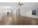 Open-concept living area showcases smooth flooring and integrates with a modern kitchen setup at 2434 S Colleen Sw --, Mesa, AZ 85210