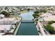 Picturesque aerial view of lakeside homes with a walking bridge and immaculately landscaped community at 254 W Amoroso Dr, Gilbert, AZ 85233