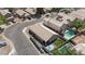 Bird's eye view of a residential area featuring manicured yards, inviting pool, and well-maintained homes at 254 W Amoroso Dr, Gilbert, AZ 85233